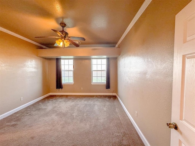 unfurnished room featuring crown molding, carpet floors, a textured ceiling, and ceiling fan