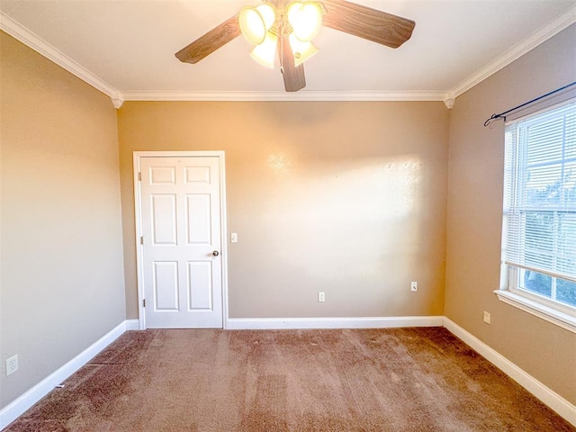 carpeted spare room featuring a wealth of natural light, crown molding, and ceiling fan