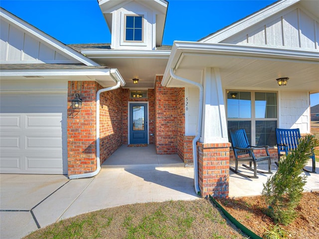 property entrance with a porch and a garage