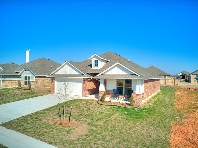 craftsman-style house with a garage and a front lawn