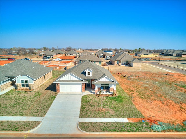 view of front of home with a front lawn and a garage