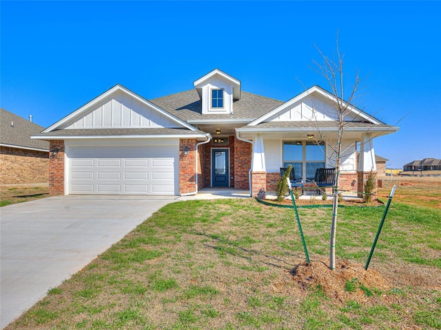 craftsman-style home with a porch, a front yard, and a garage