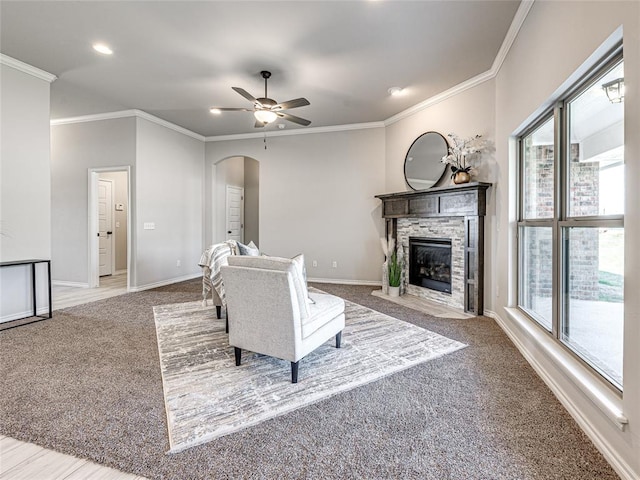 unfurnished living room featuring crown molding and plenty of natural light