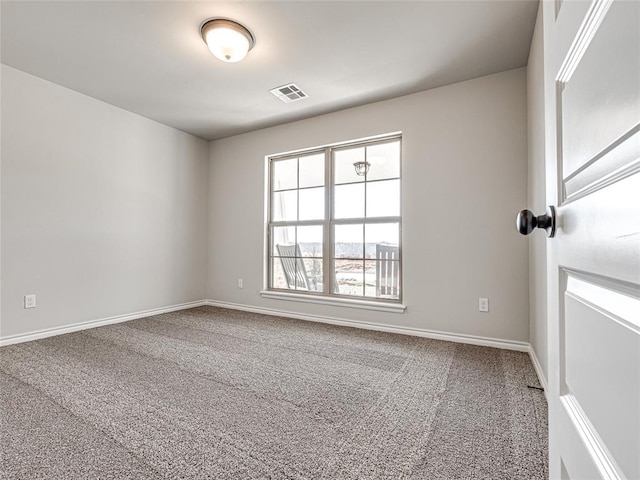 empty room featuring carpet flooring