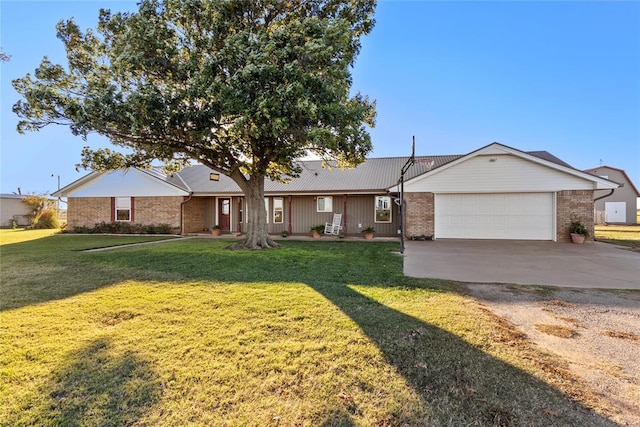 ranch-style home featuring a garage and a front lawn