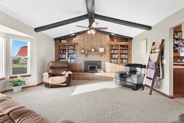 carpeted living room featuring lofted ceiling with beams, a wood stove, and ceiling fan