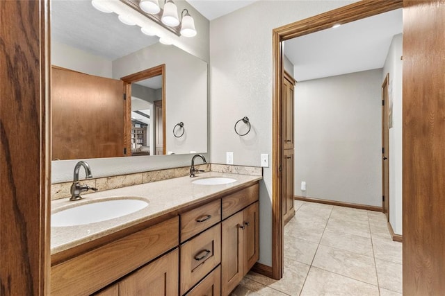 bathroom with vanity and tile patterned floors