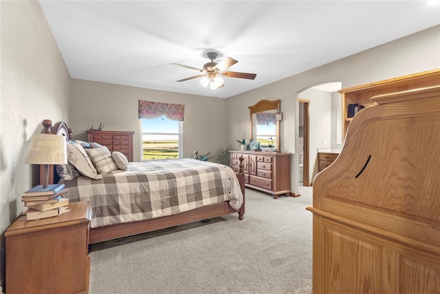 bedroom with ceiling fan and light colored carpet