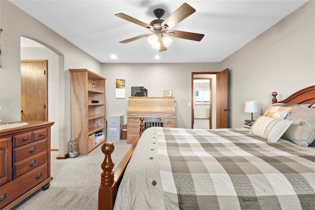 bedroom featuring ceiling fan and light colored carpet