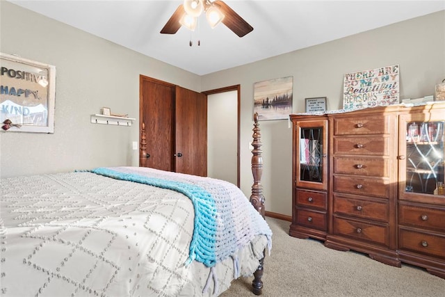 bedroom featuring ceiling fan, carpet floors, and a closet