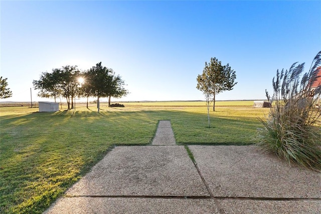 view of yard with a rural view