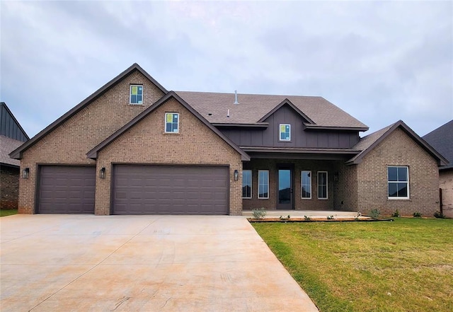 craftsman house with a garage and a front lawn