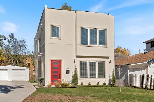 view of front of home featuring a front yard and a garage