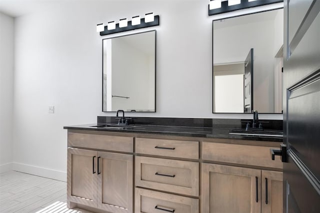 bathroom with hardwood / wood-style floors and vanity