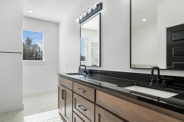 bathroom featuring vanity and wood-type flooring