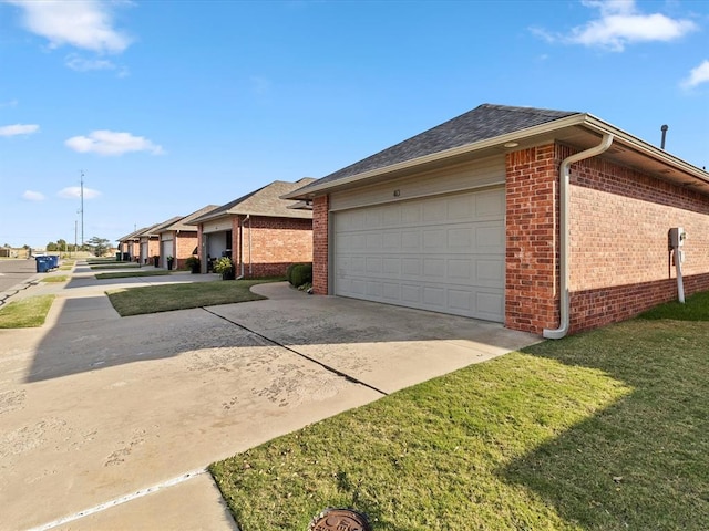 view of home's exterior featuring a yard and a garage