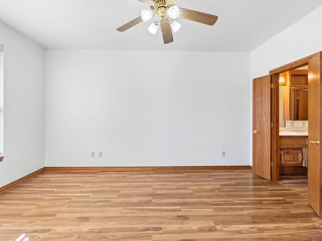 empty room featuring ceiling fan and light hardwood / wood-style floors