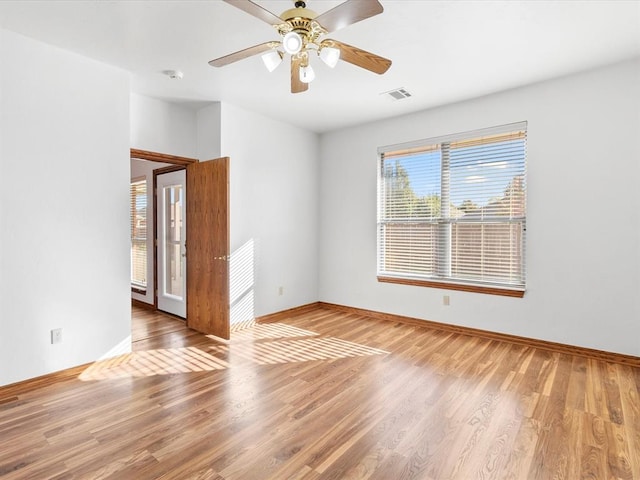 spare room featuring ceiling fan and wood-type flooring