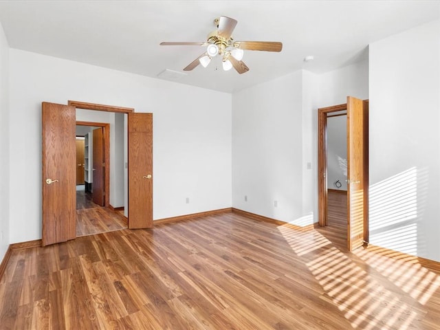 interior space with hardwood / wood-style flooring and ceiling fan