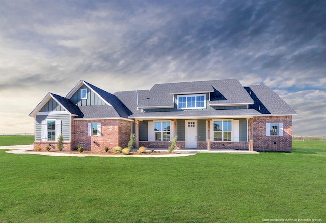 craftsman-style house featuring covered porch and a front lawn