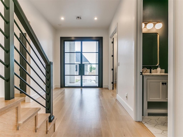 entrance foyer with light hardwood / wood-style floors