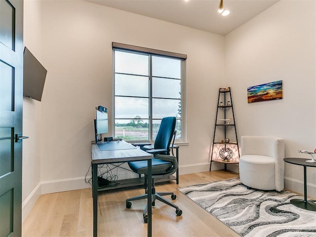 office area with light hardwood / wood-style flooring