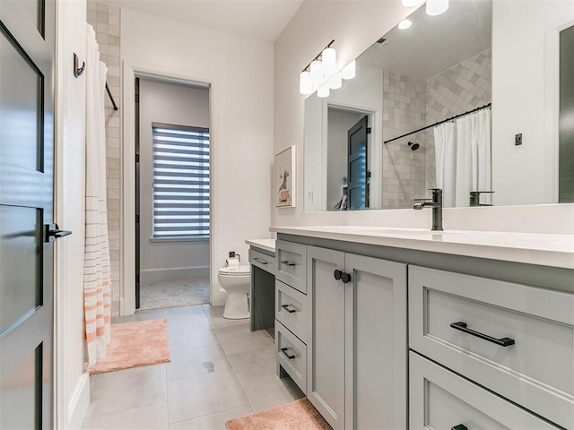 bathroom with tile patterned floors, vanity, a shower with shower curtain, and toilet