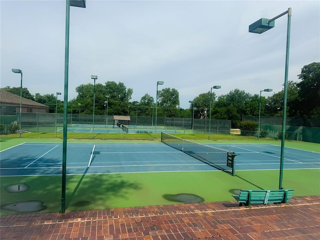 view of sport court with basketball hoop