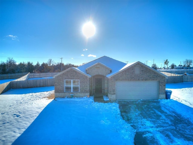 single story home featuring a garage