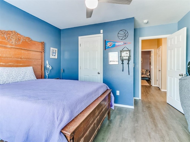 bedroom featuring ceiling fan and light hardwood / wood-style floors