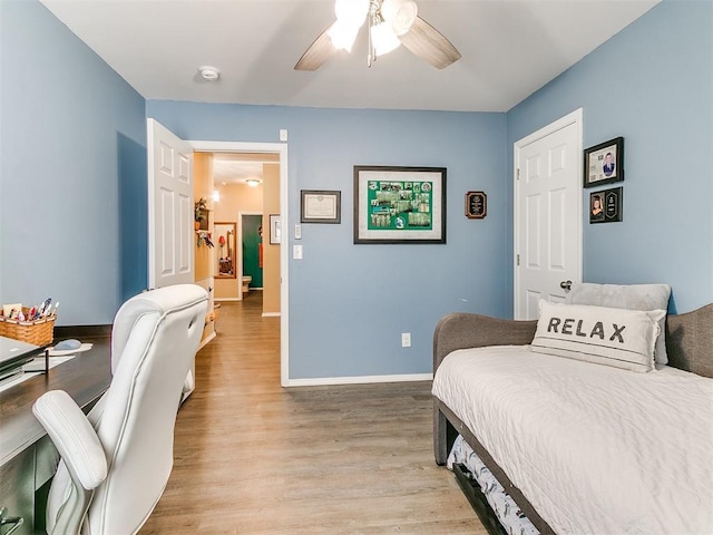 bedroom featuring ceiling fan and light hardwood / wood-style flooring