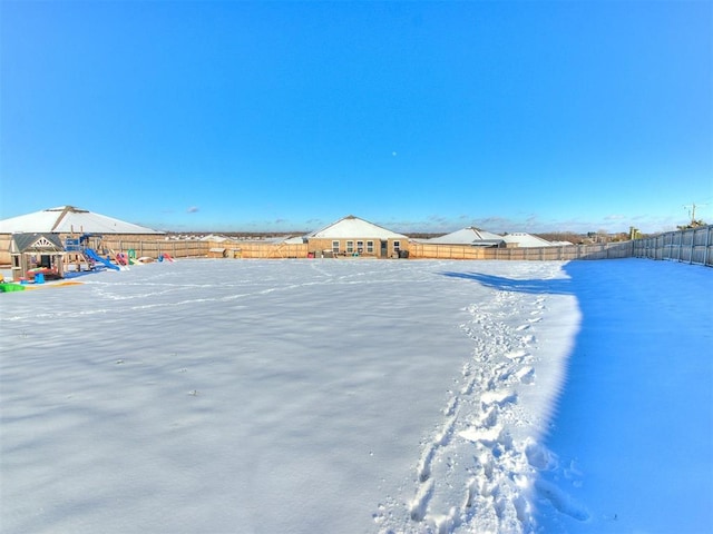 view of yard layered in snow