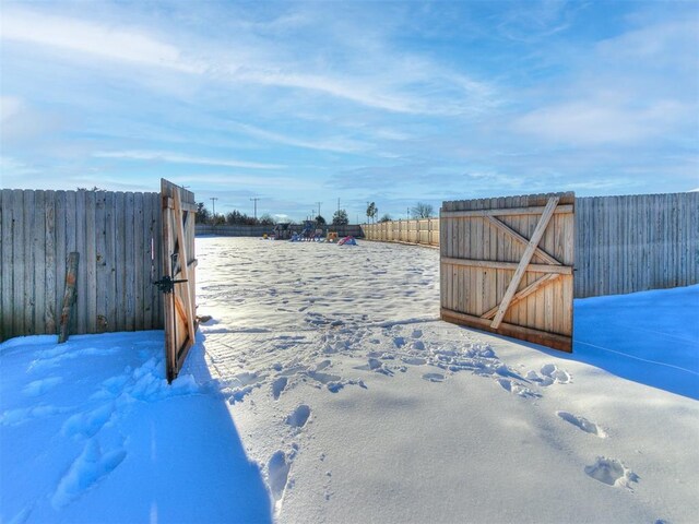 view of yard layered in snow