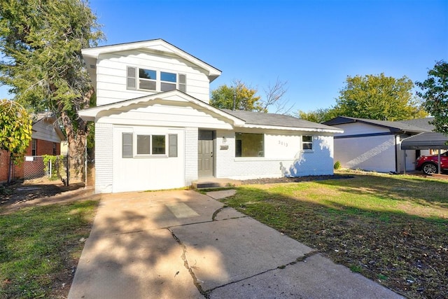 view of property featuring a front lawn