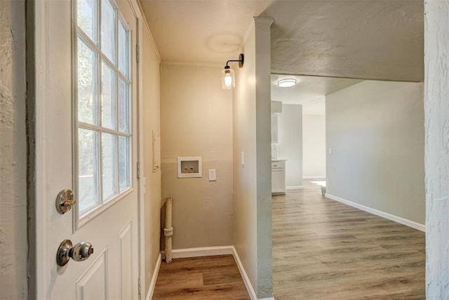 interior space featuring ornamental molding and hardwood / wood-style flooring