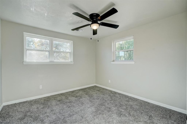 unfurnished room with carpet flooring and ceiling fan