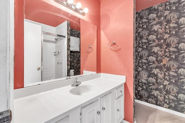 bathroom featuring tile patterned floors, vanity, and walk in shower