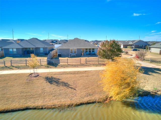 view of front of house featuring a water view