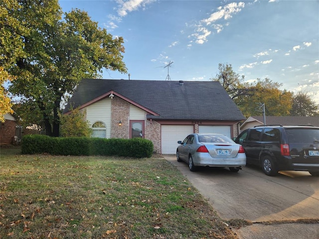 single story home with a garage and a front lawn