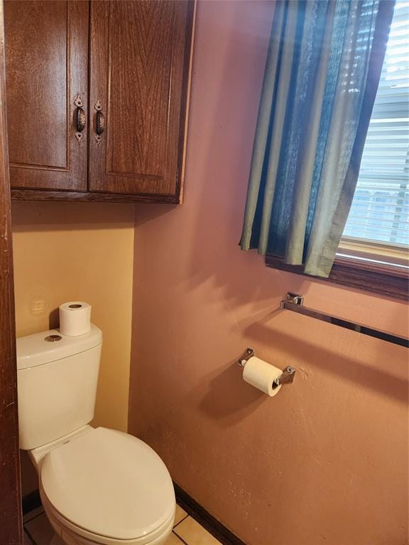 bathroom with tile patterned floors and toilet