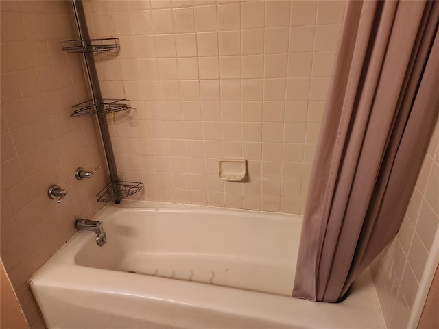 bathroom featuring shower / bathtub combination with curtain