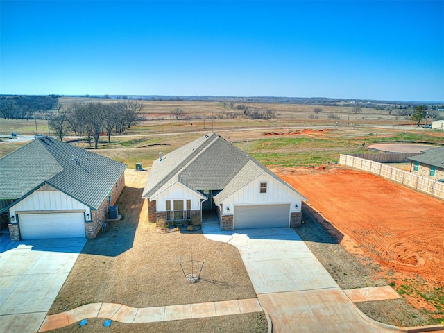 birds eye view of property with a rural view