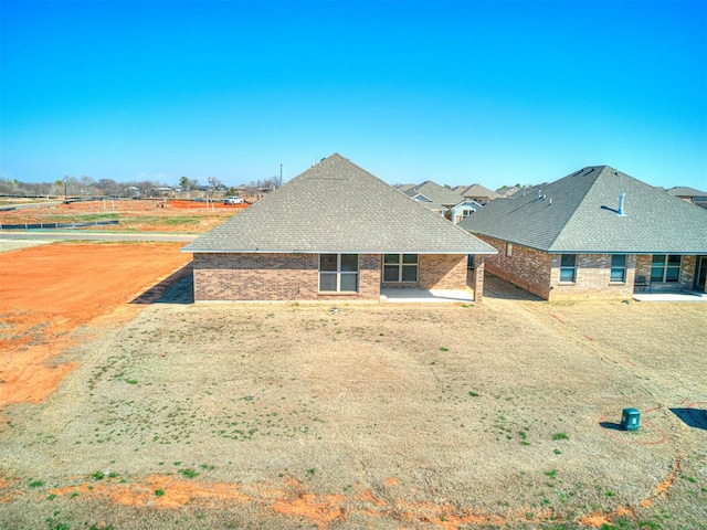 back of property with a patio