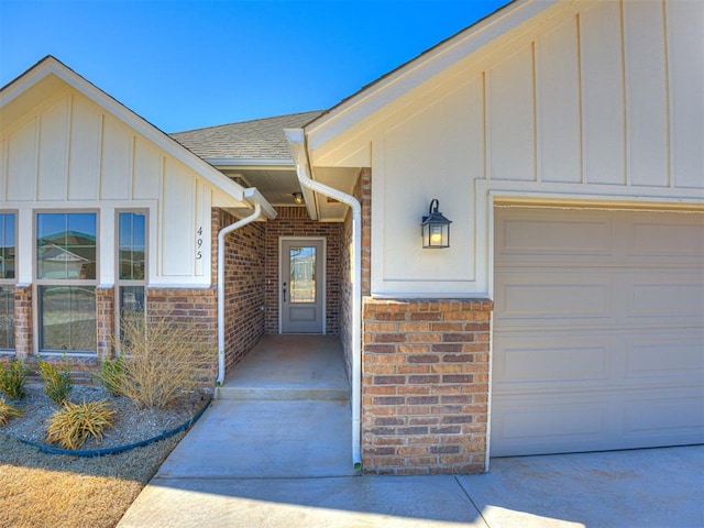 doorway to property featuring a garage