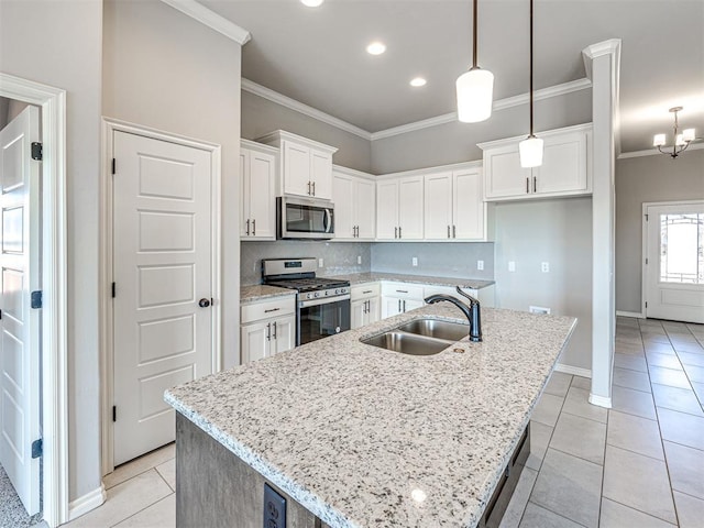 kitchen featuring a center island with sink, white cabinetry, sink, and appliances with stainless steel finishes