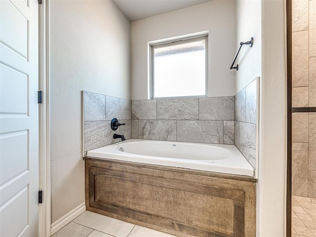 bathroom featuring a tub and tile patterned flooring