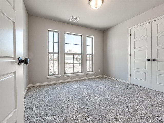 view of carpeted spare room