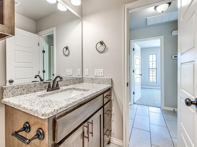 bathroom with tile patterned flooring and vanity