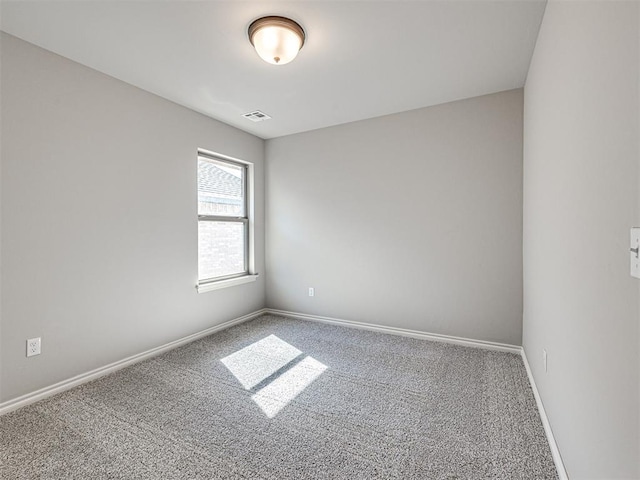 unfurnished room featuring carpet flooring