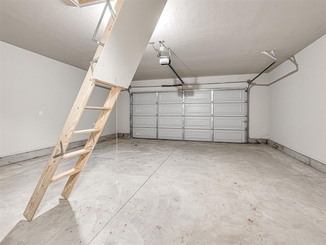 garage featuring a garage door opener